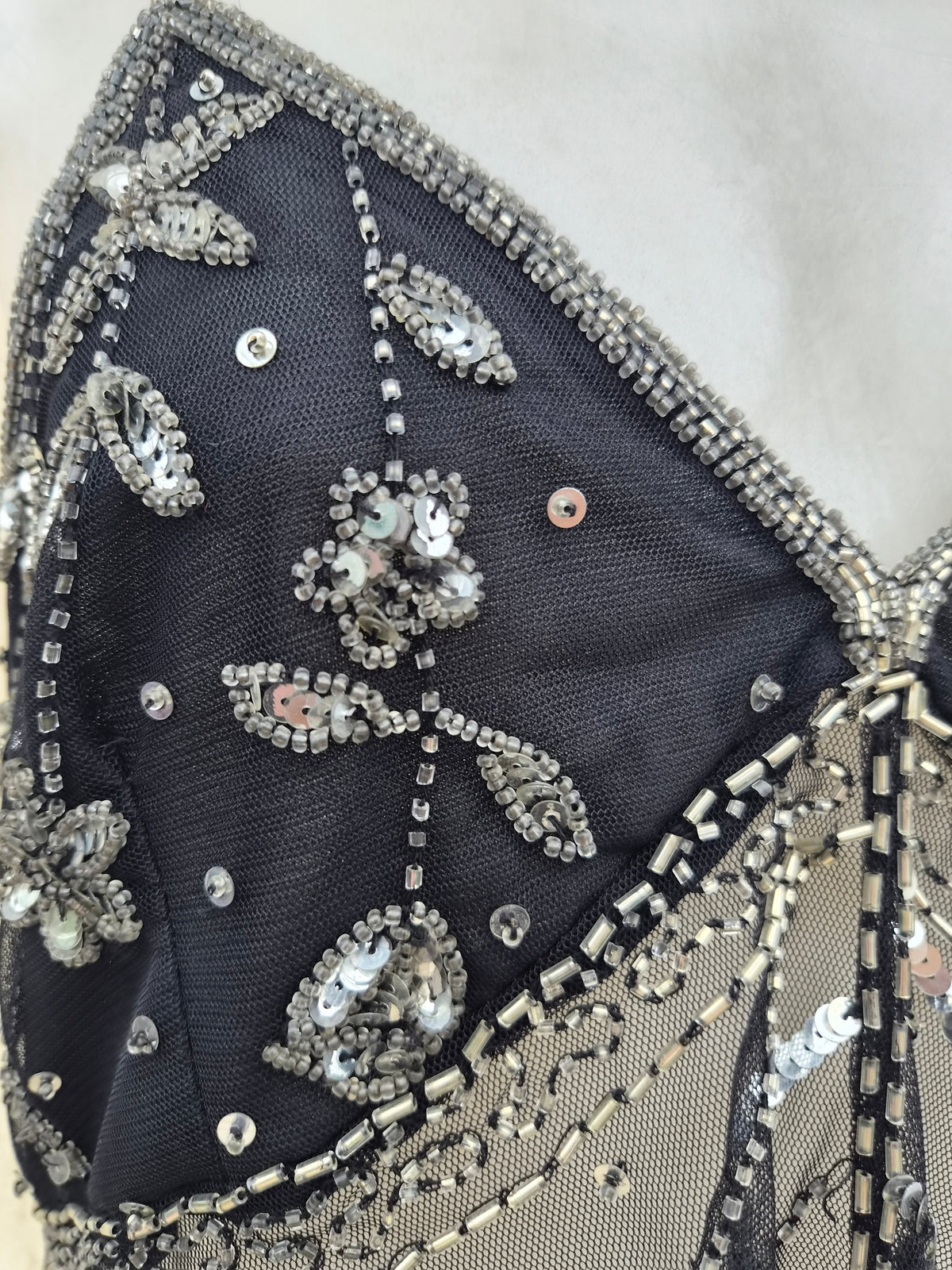 Black and silver embroidered asymmetric chiffon top