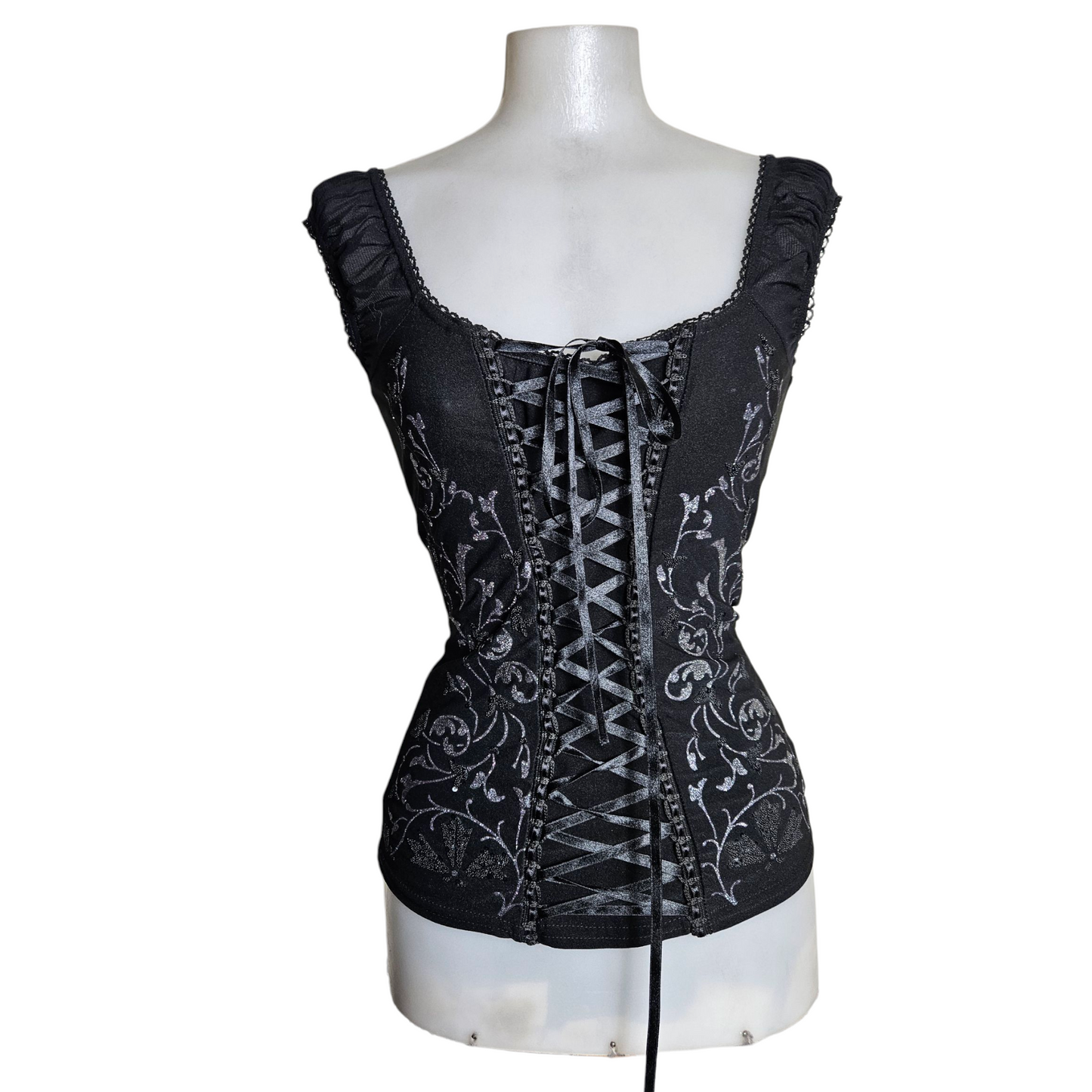 Lace-up top decorated with silver arabesques