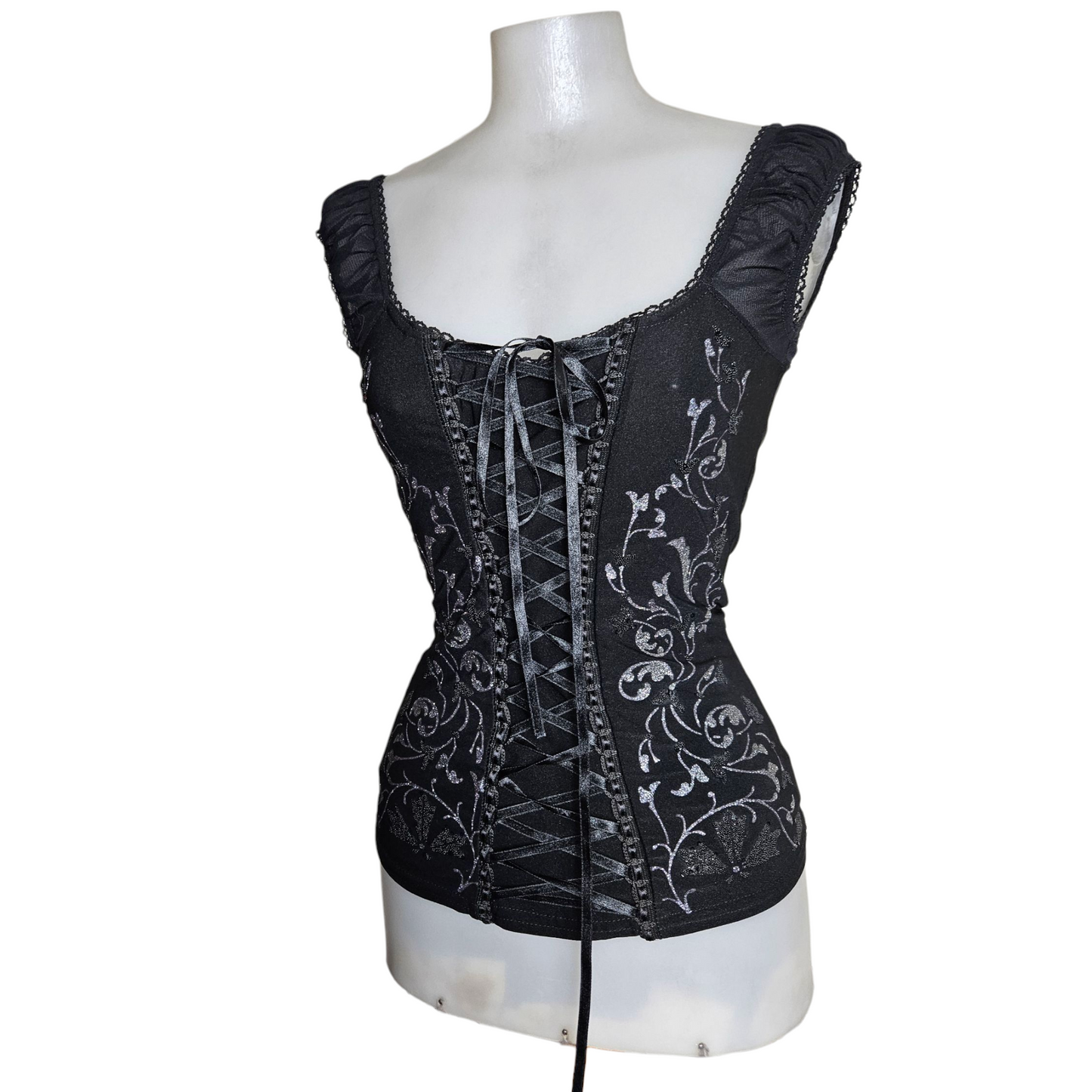 Lace-up top decorated with silver arabesques