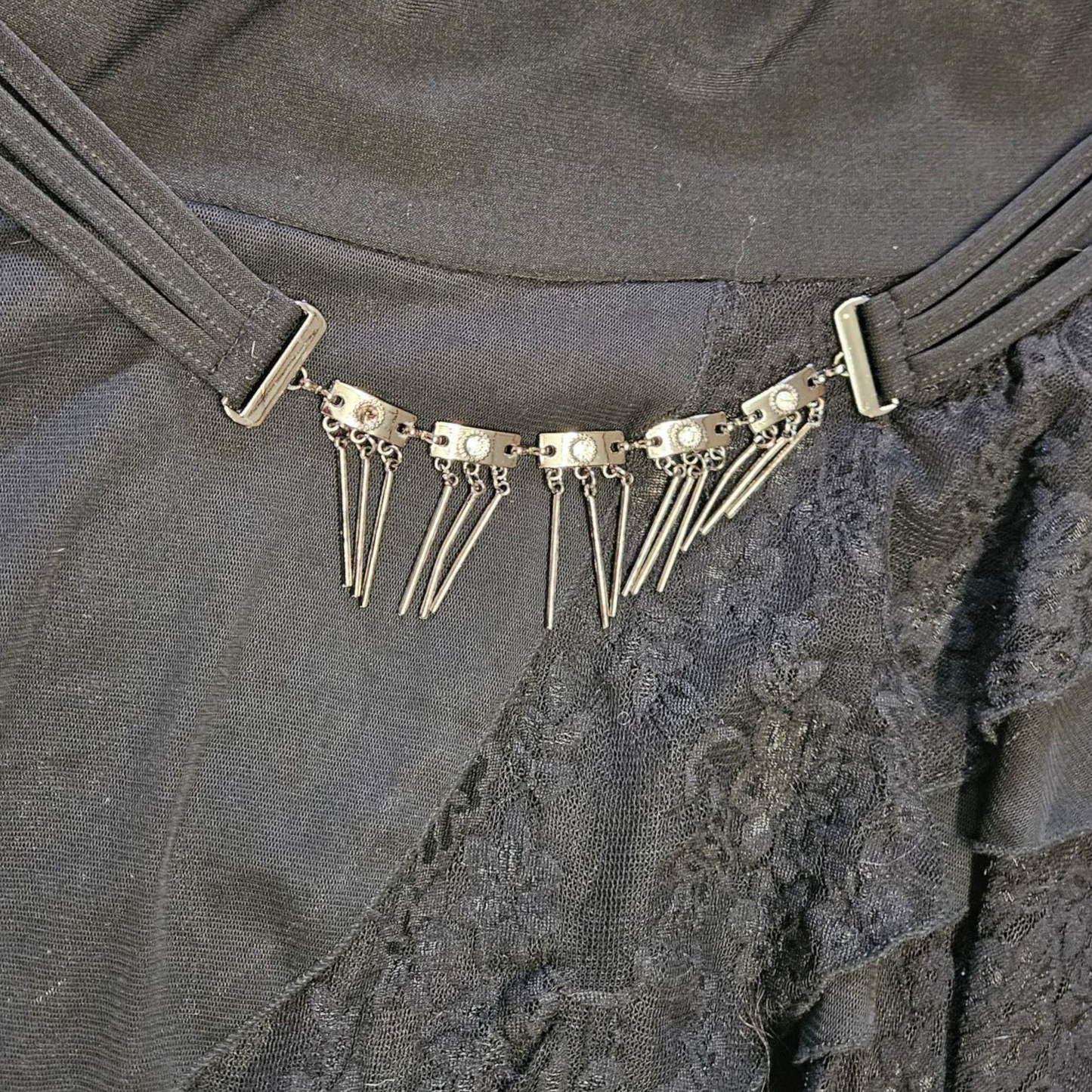 Asymmetrical lace skirt with chain details
