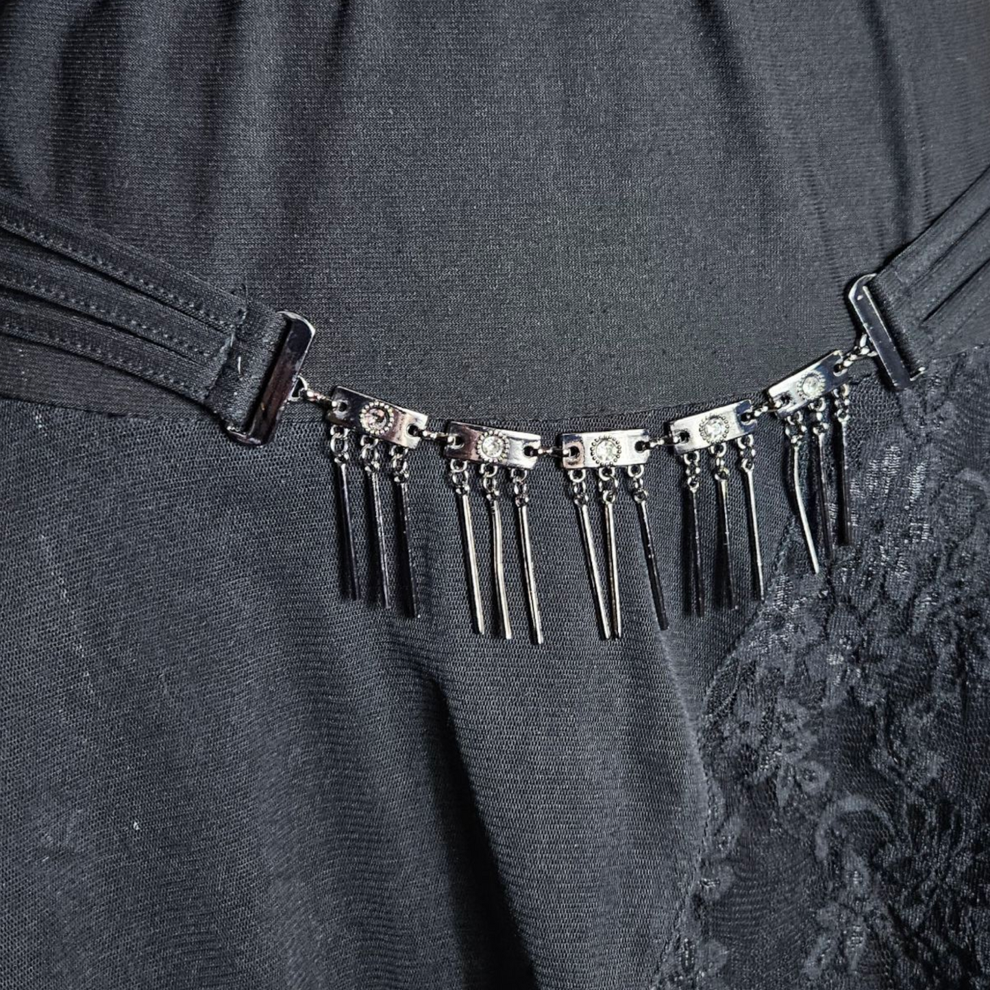 Asymmetrical lace skirt with chain details