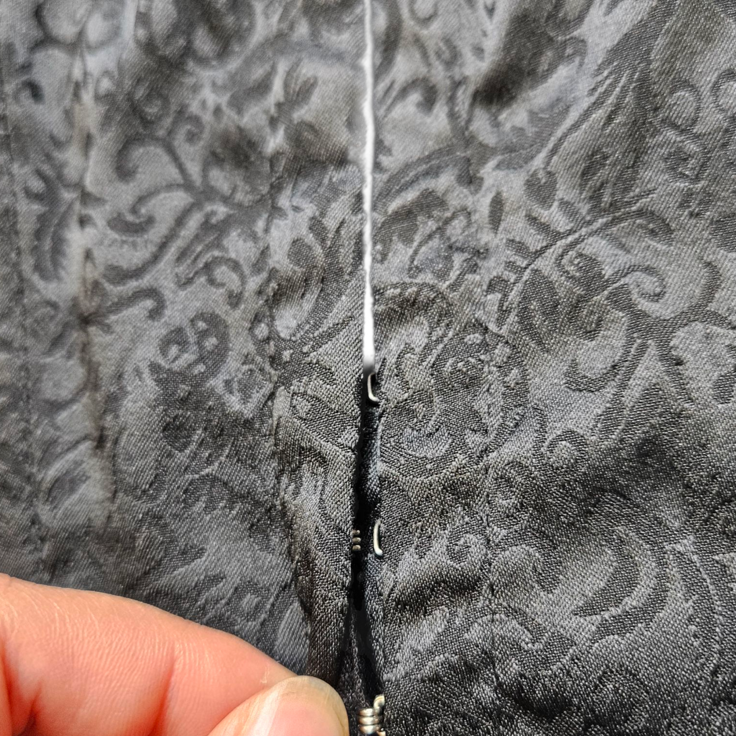 Black top with arabesque pattern