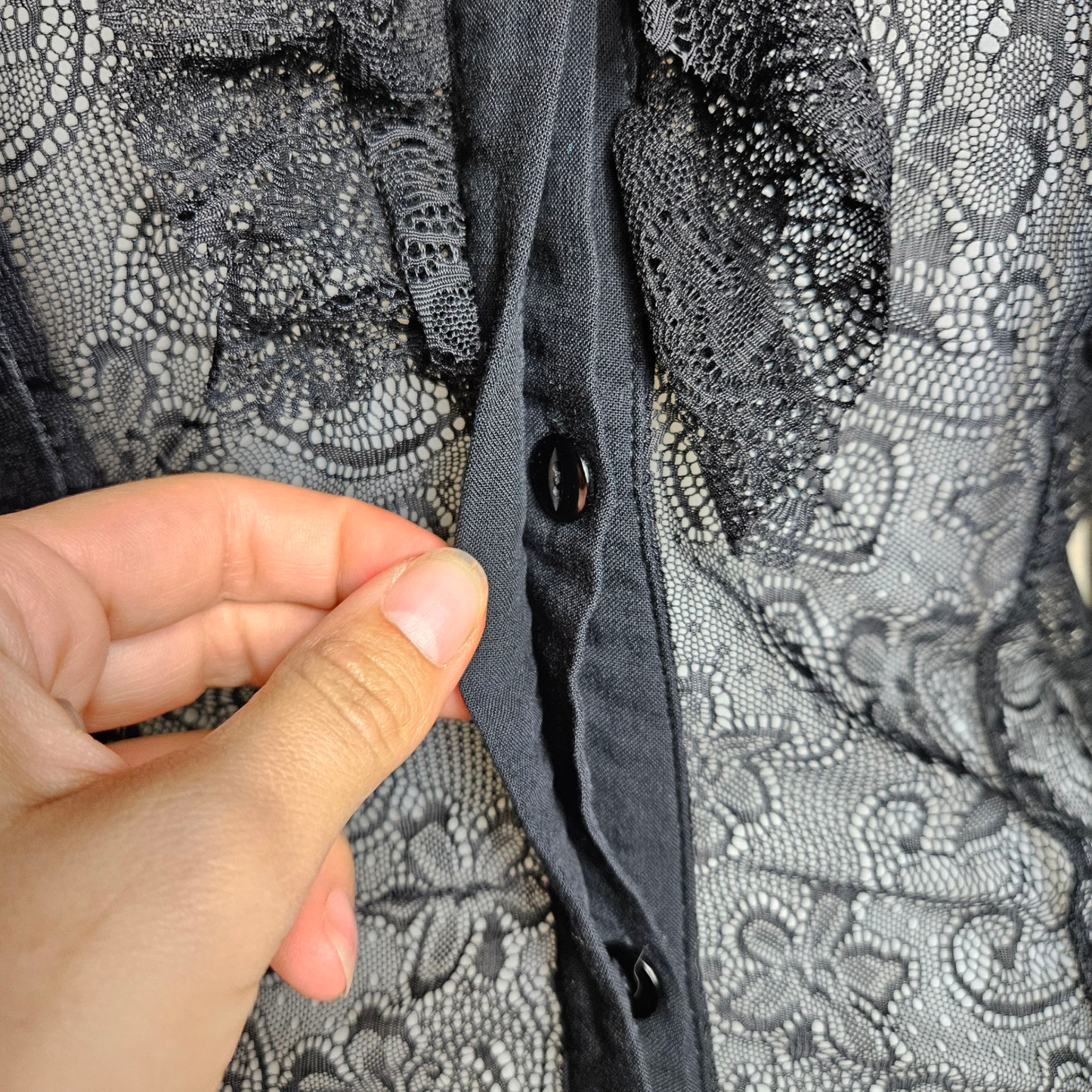 Black lace blouse with key buckle