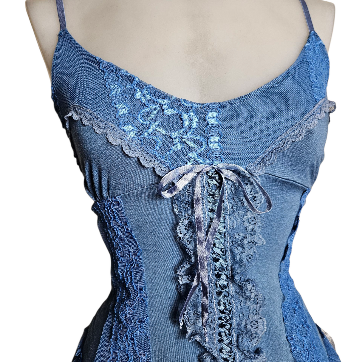 Blue asymmetrical top with lace and lacing
