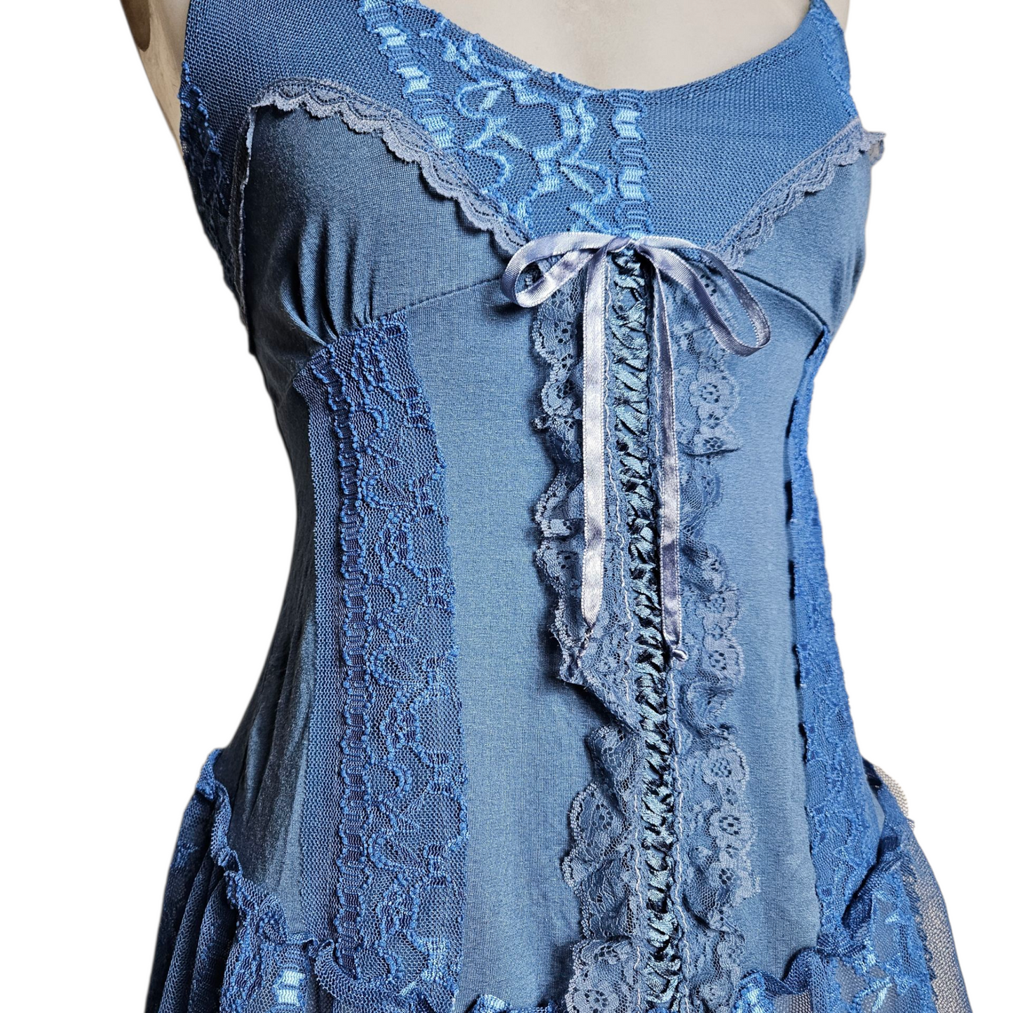 Blue asymmetrical top with lace and lacing