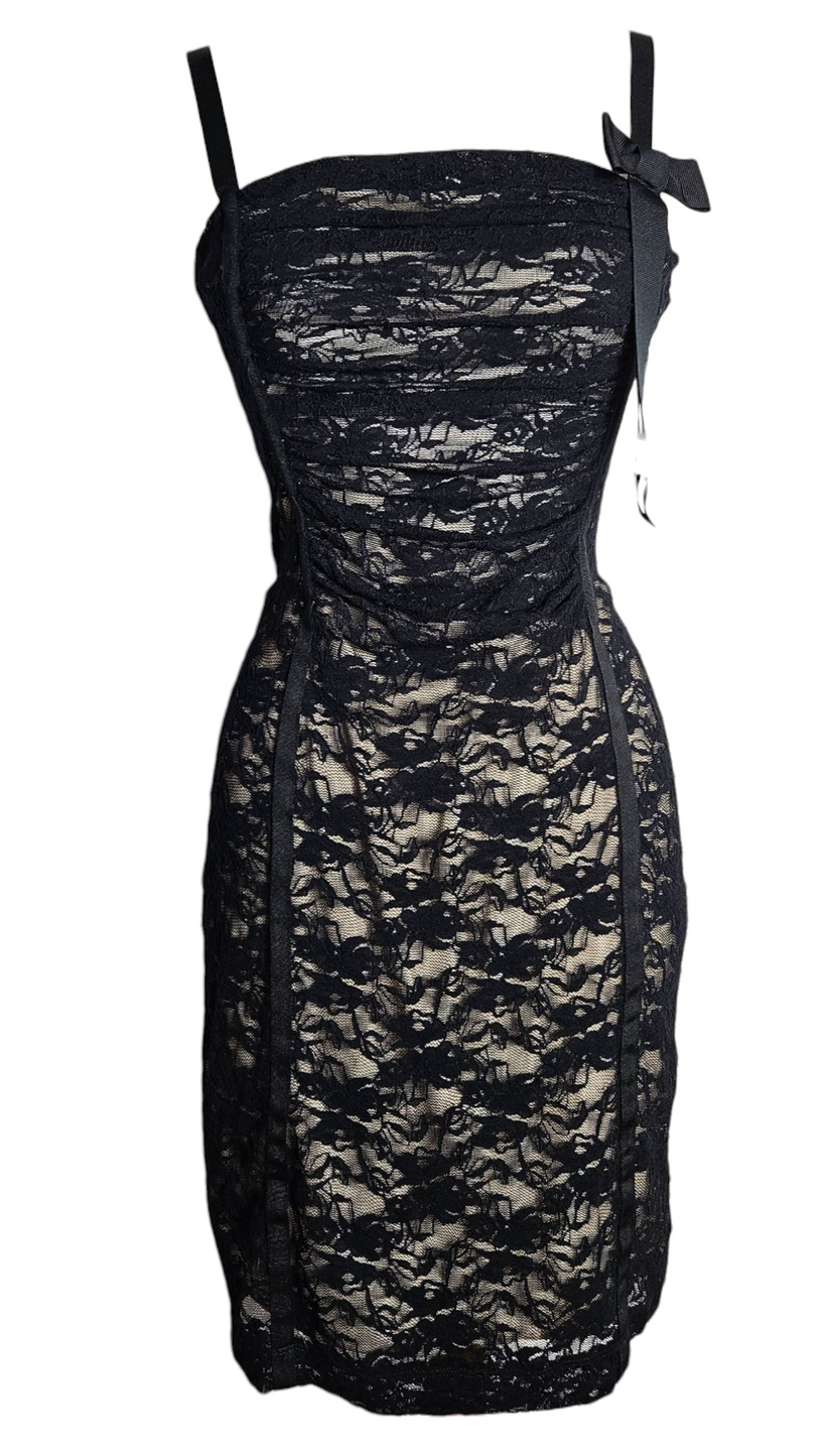 Vintage black lace corset-style mini dress with delicate straps and ribbon detail, elegant Y2K fairycore and dark whimsigoth aesthetic.