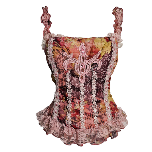 Top corset vintage rose à imprimés floraux, vue de face, avec bretelles volantées et détails en dentelle