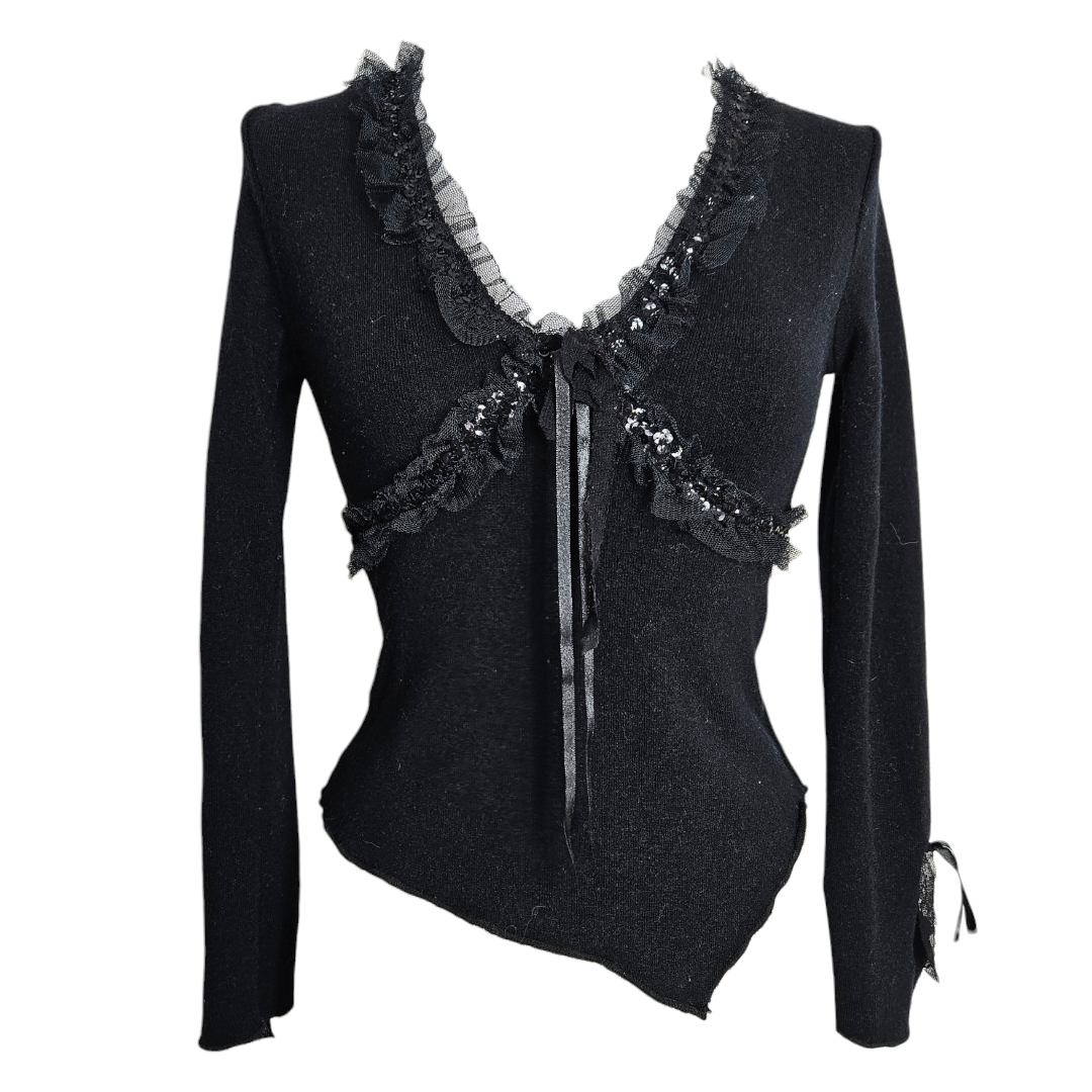 Vintage black sheer floral lace cardigan with long sleeves, tiered ruffle cuffs, and a delicate tie-front closure. by Lucid Dream 2007