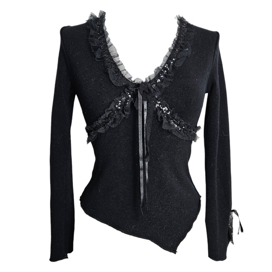 Vintage black sheer floral lace cardigan with long sleeves, tiered ruffle cuffs, and a delicate tie-front closure. by Lucid Dream 2007