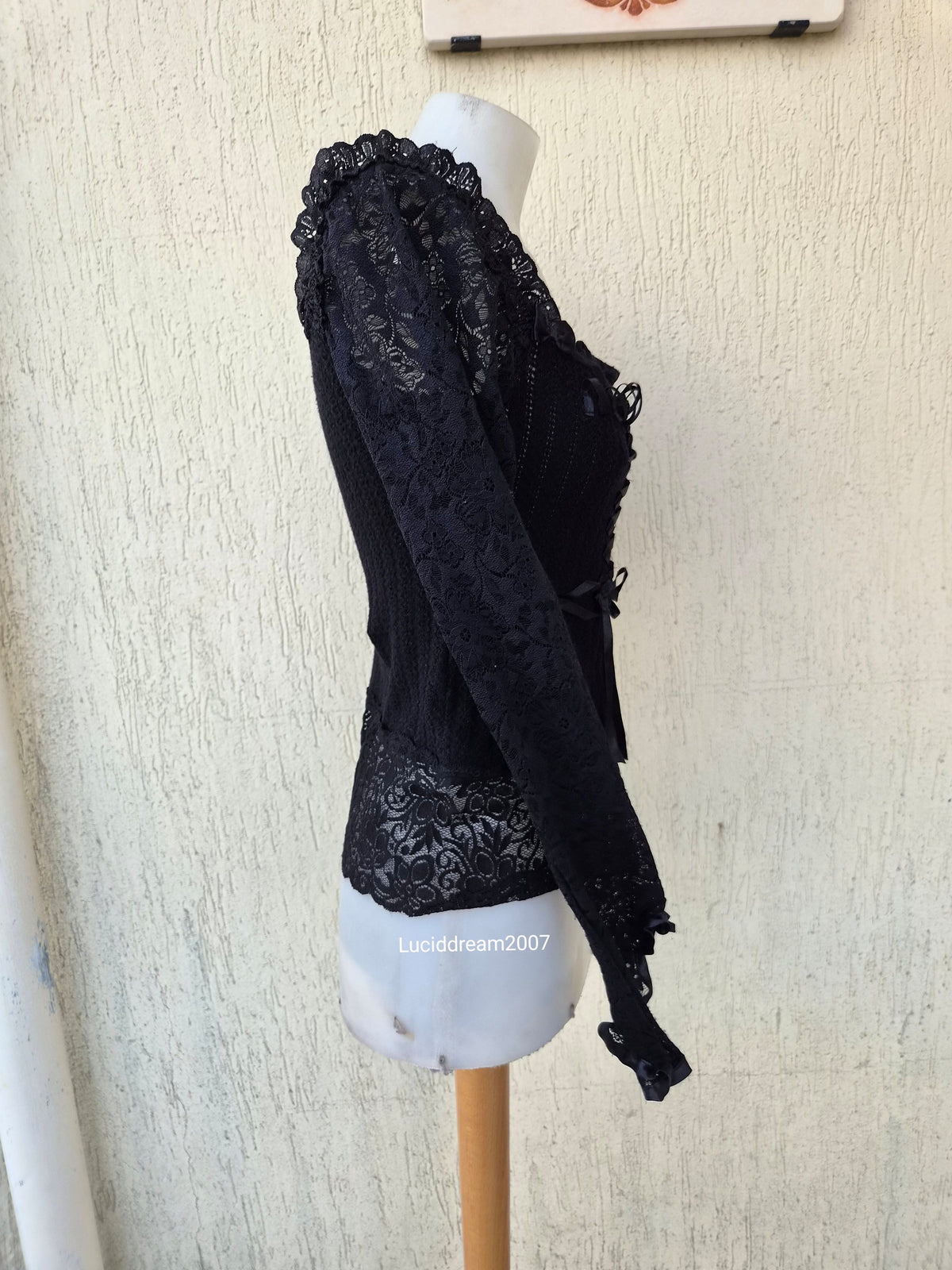 Black sweater with lace and ribbon details
