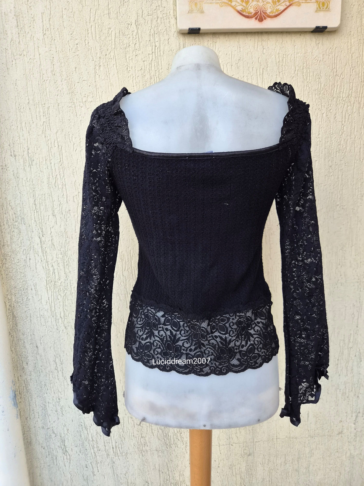 Black sweater with lace and ribbon details