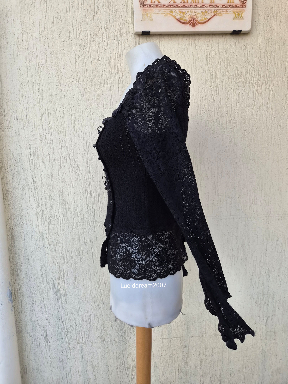 Black sweater with lace and ribbon details