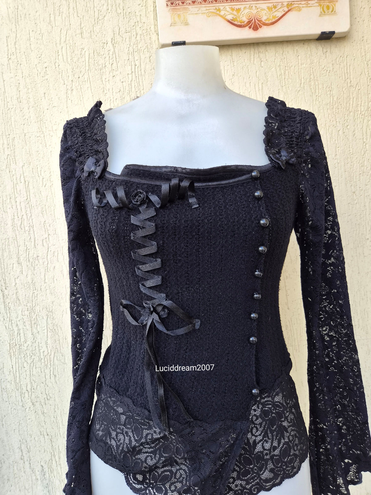 Black sweater with lace and ribbon details