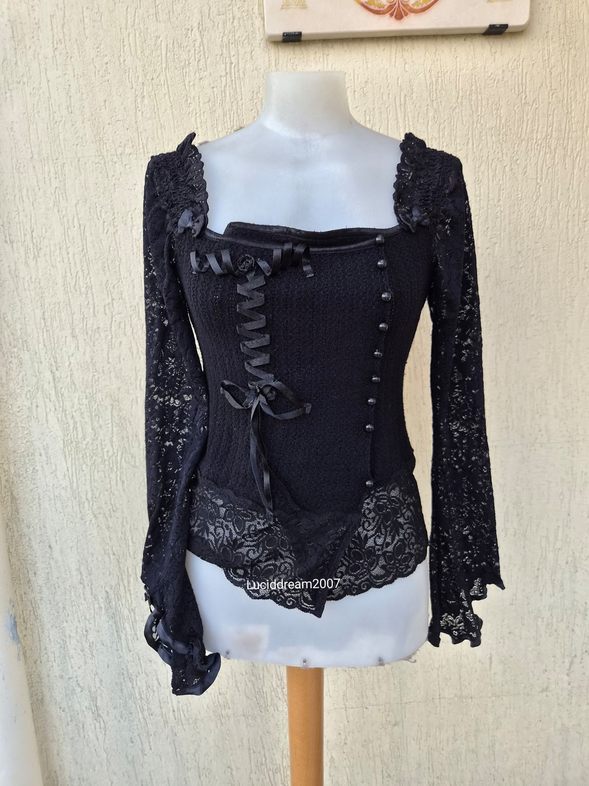 Black sweater with lace and ribbon details