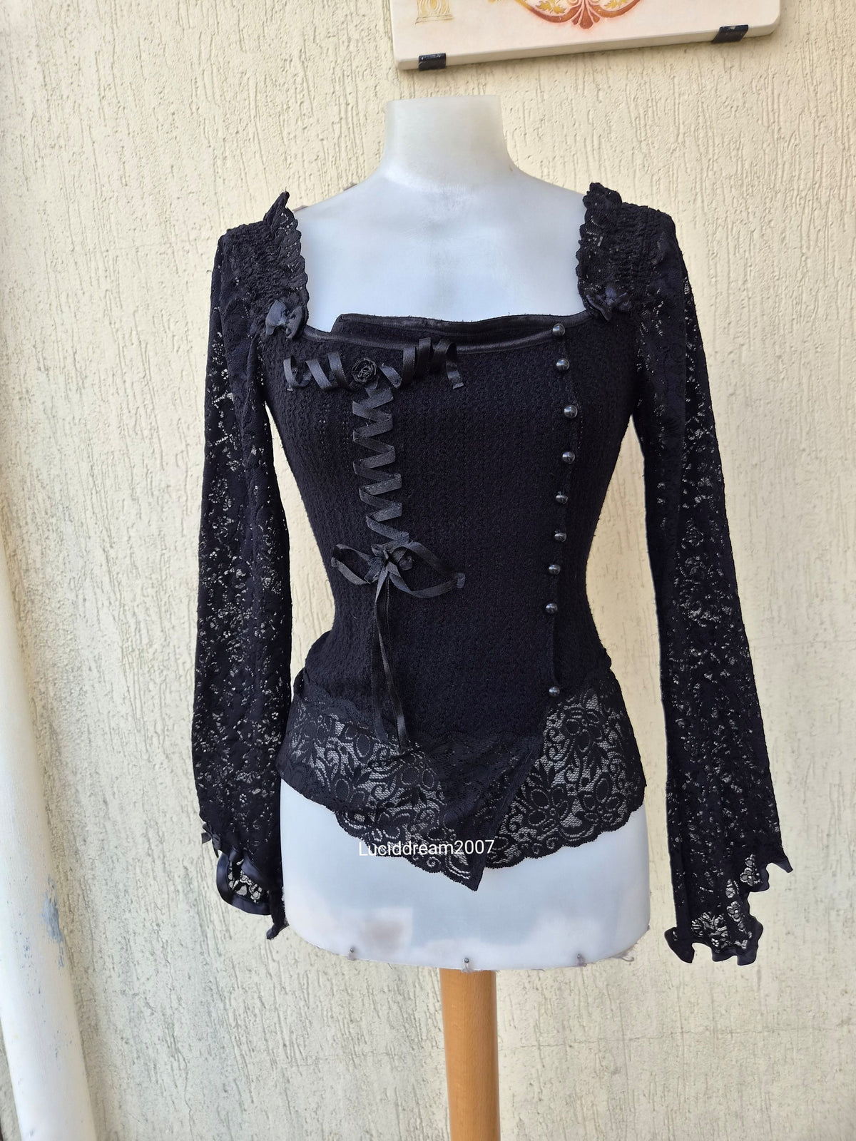 Black sweater with lace and ribbon details