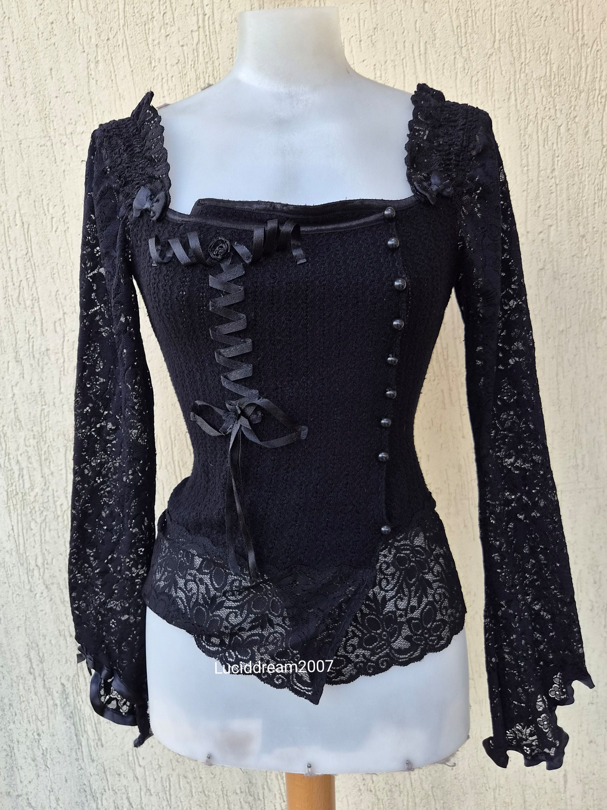 Black sweater with lace and ribbon details