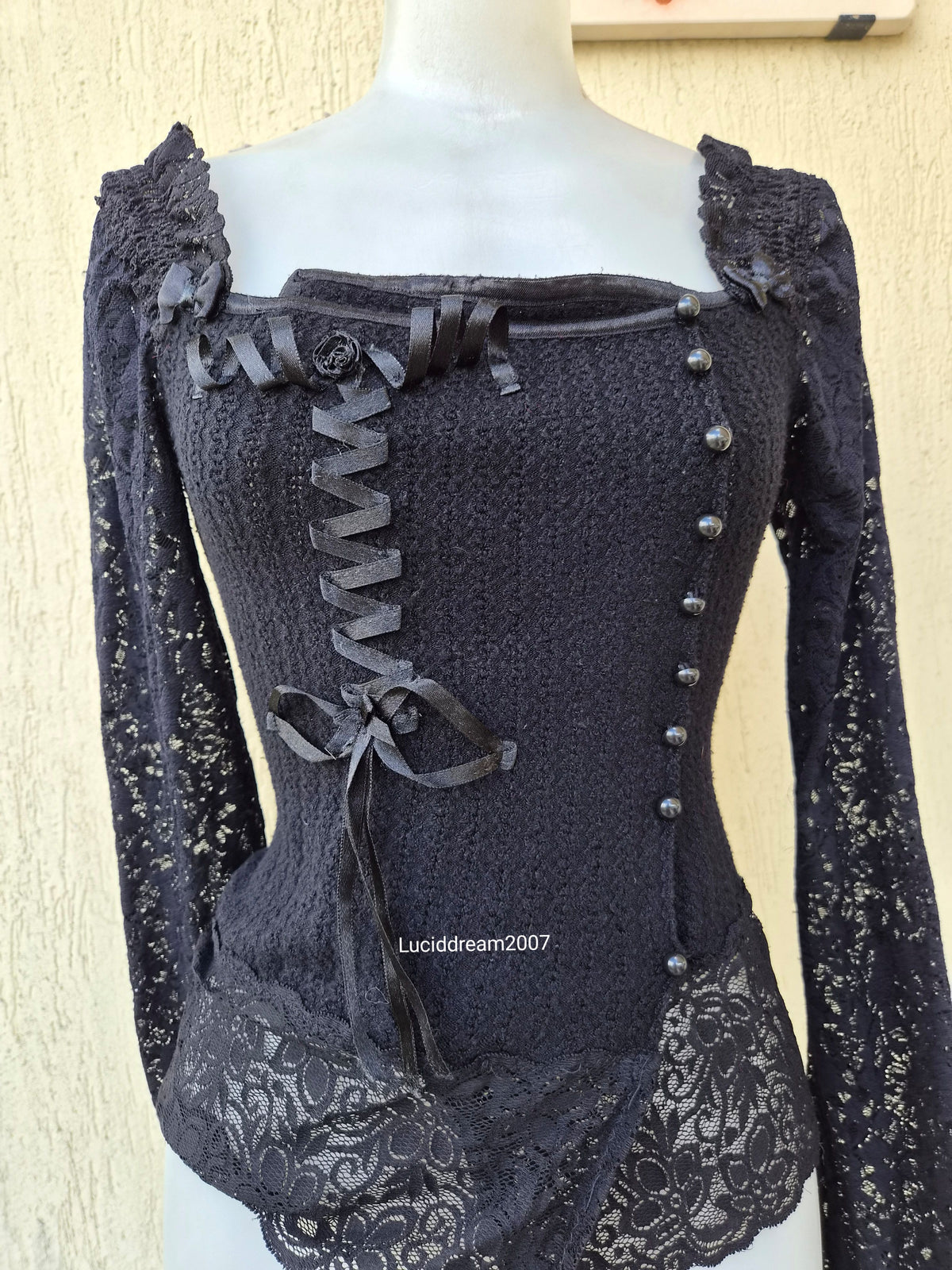 Black sweater with lace and ribbon details