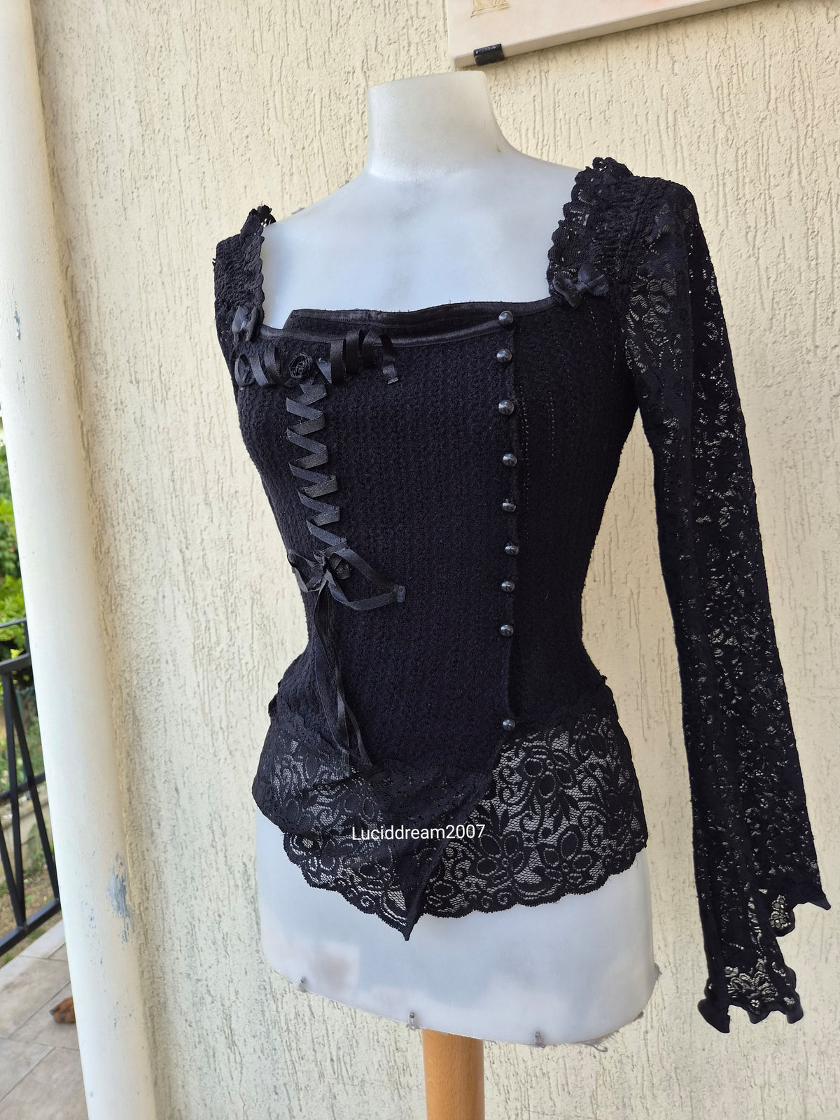 Black sweater with lace and ribbon details
