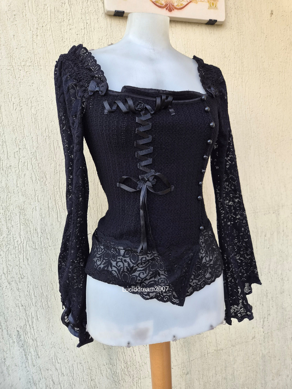 Black sweater with lace and ribbon details