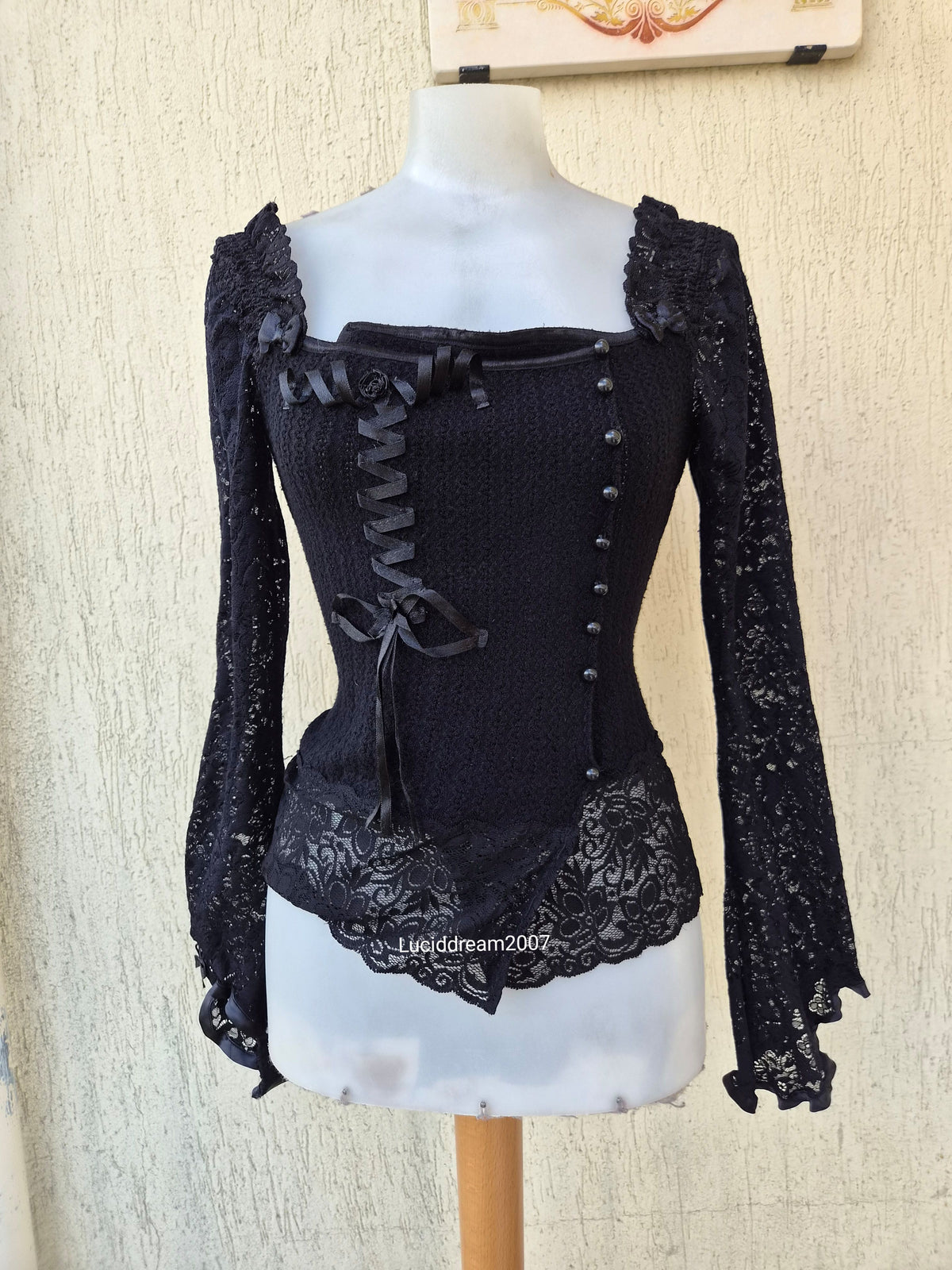 Black sweater with lace and ribbon details