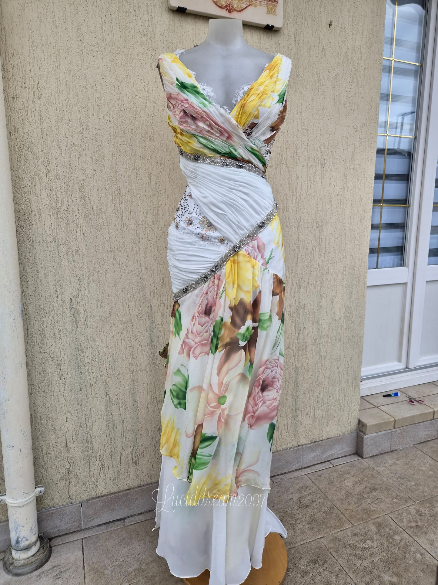 White dress with floral details and embroidery