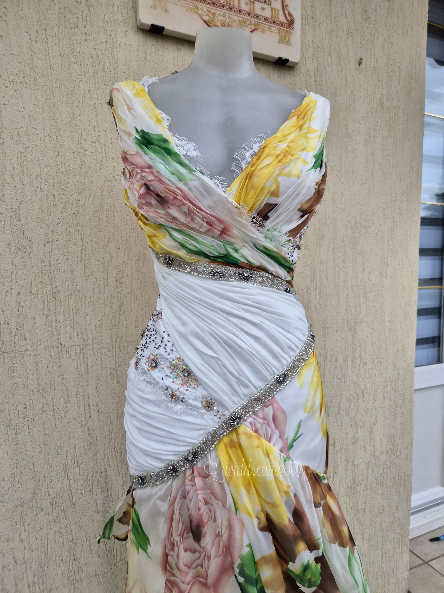 White dress with floral details and embroidery