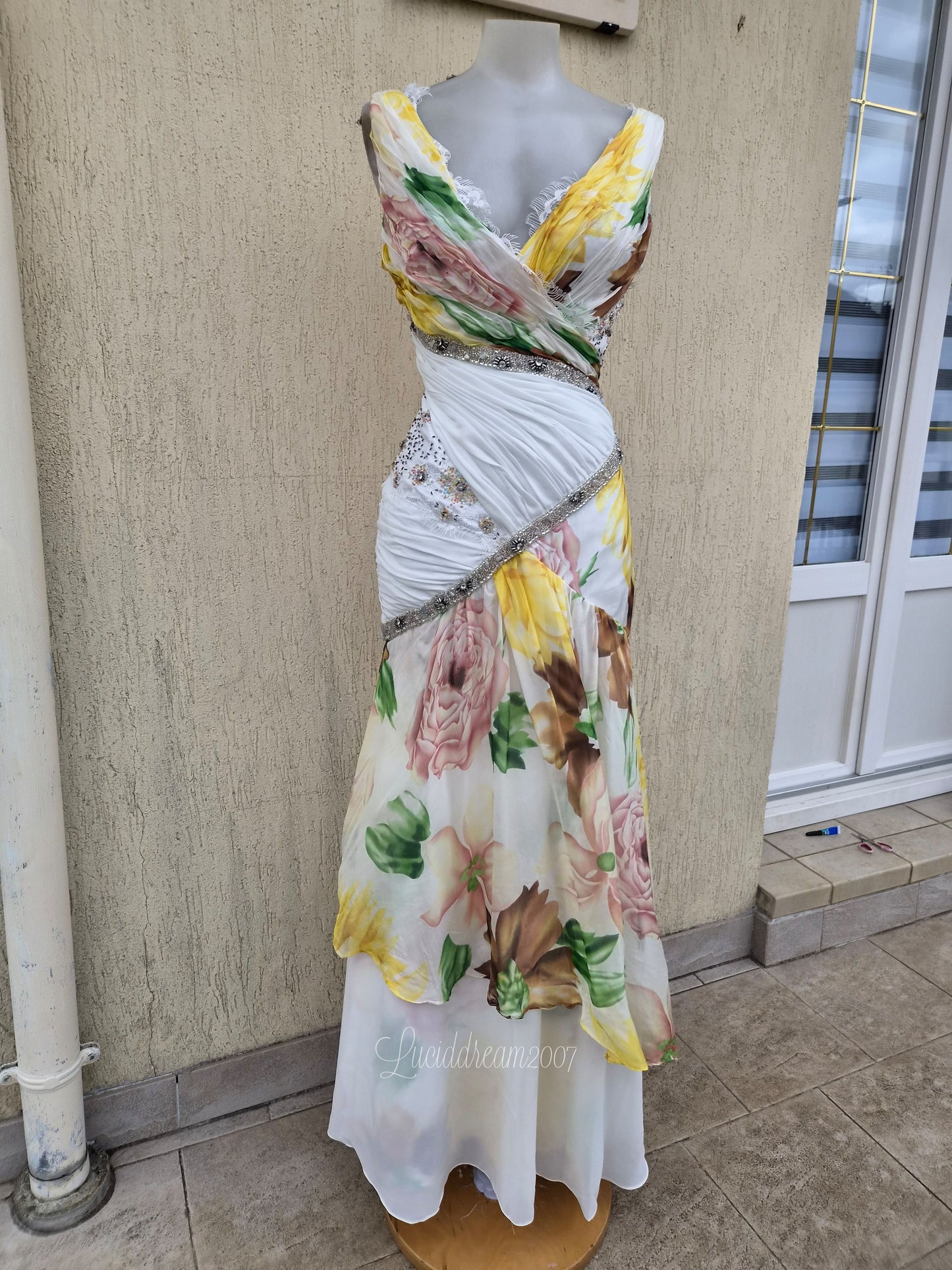 White dress with floral details and embroidery