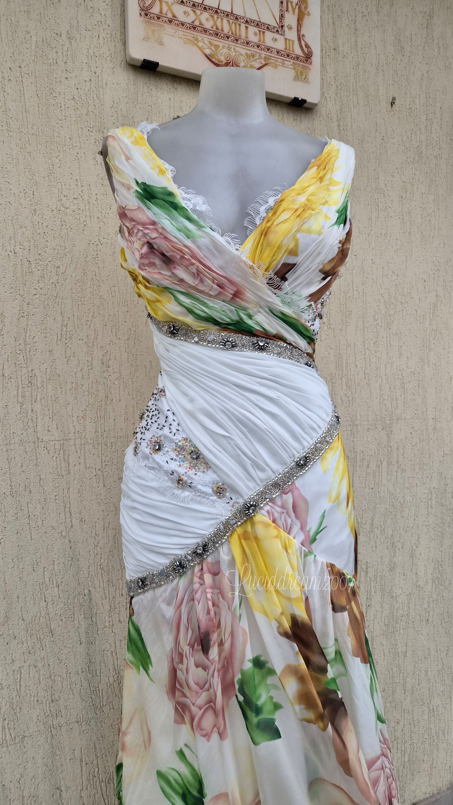 White dress with floral details and embroidery