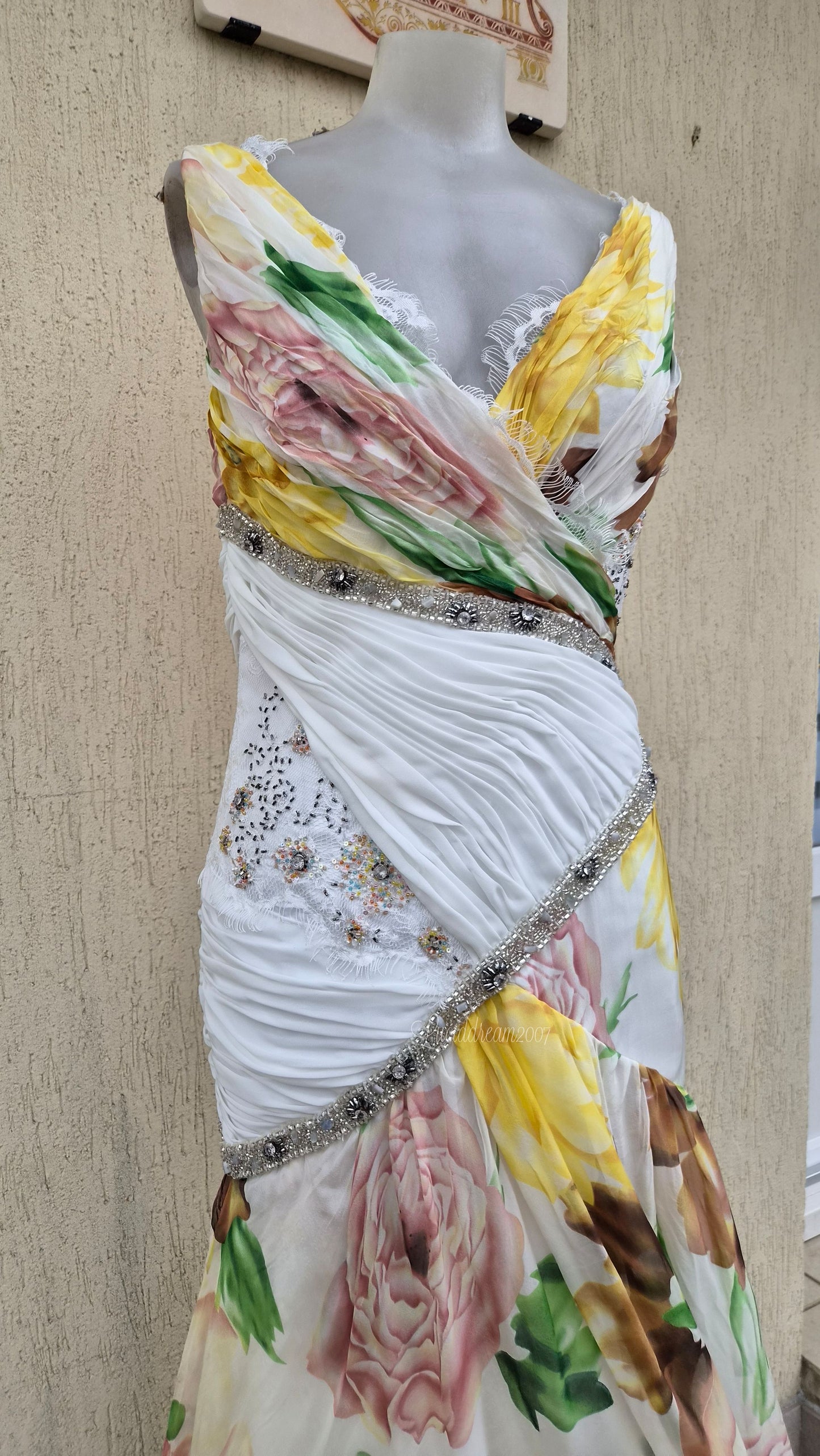 White dress with floral details and embroidery
