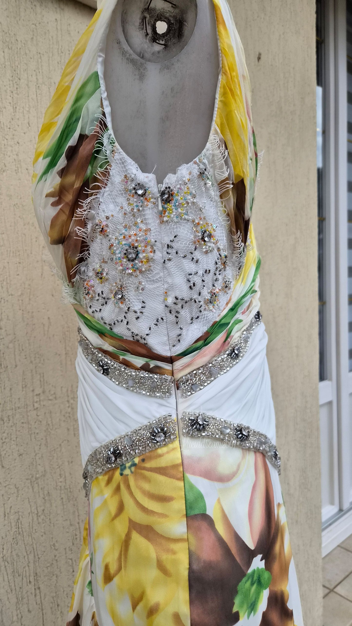White dress with floral details and embroidery