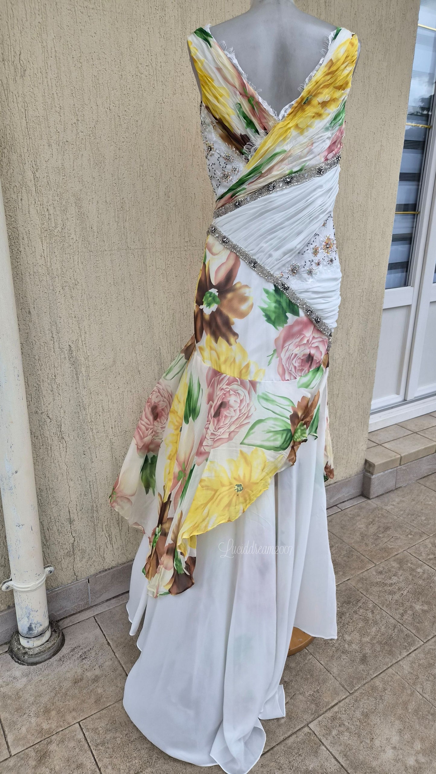 White dress with floral details and embroidery