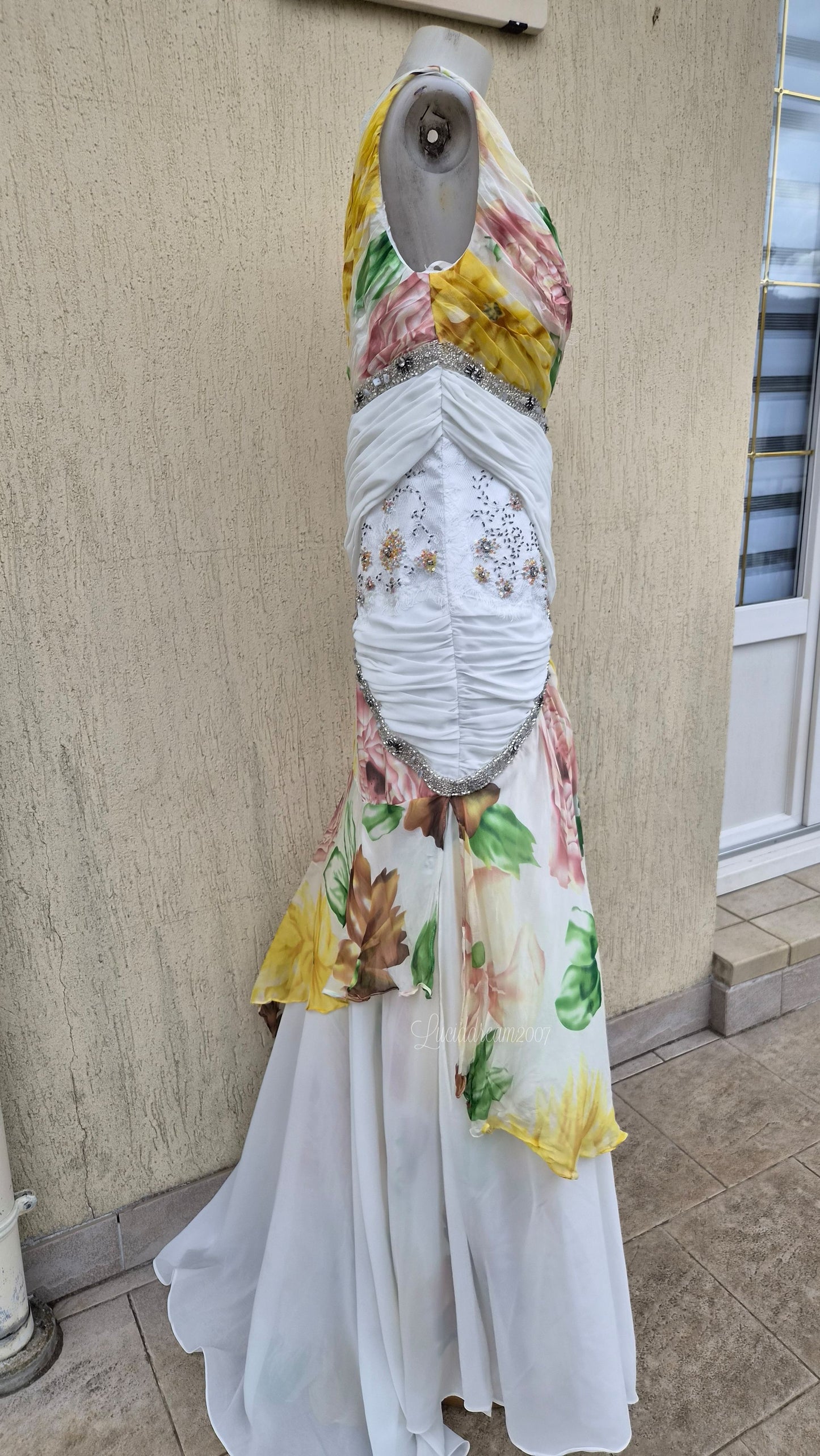 White dress with floral details and embroidery