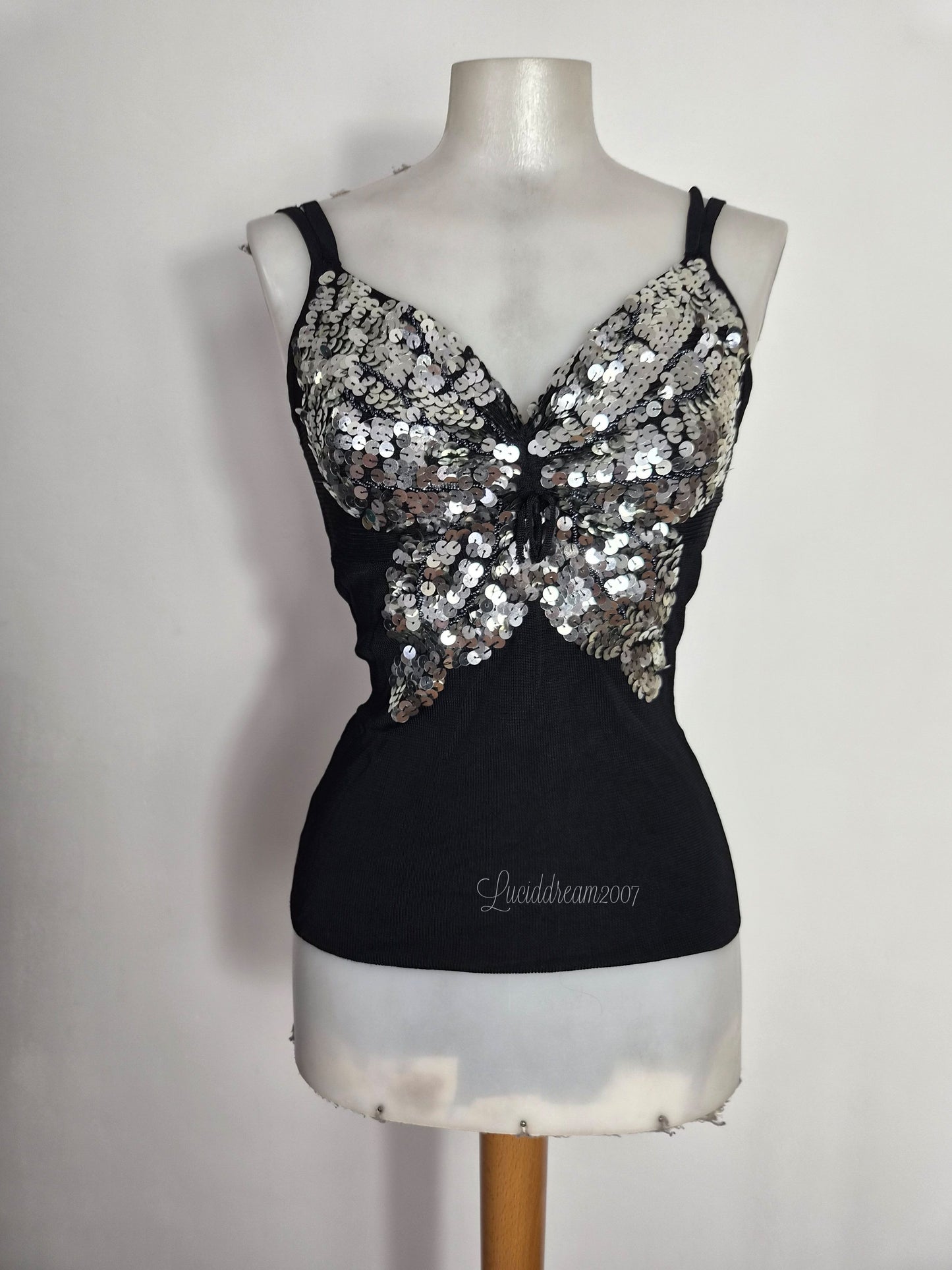 Haut noir et argenté motif papillon