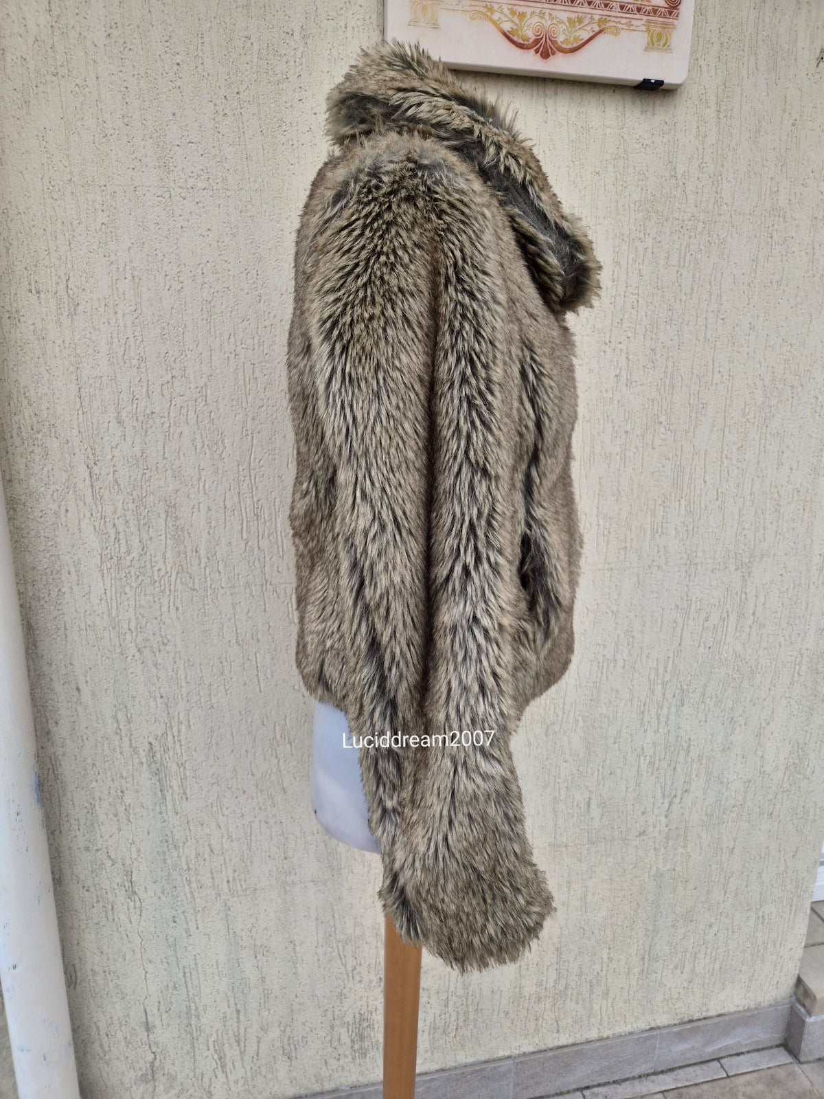 Manteau fausse fourrure beige