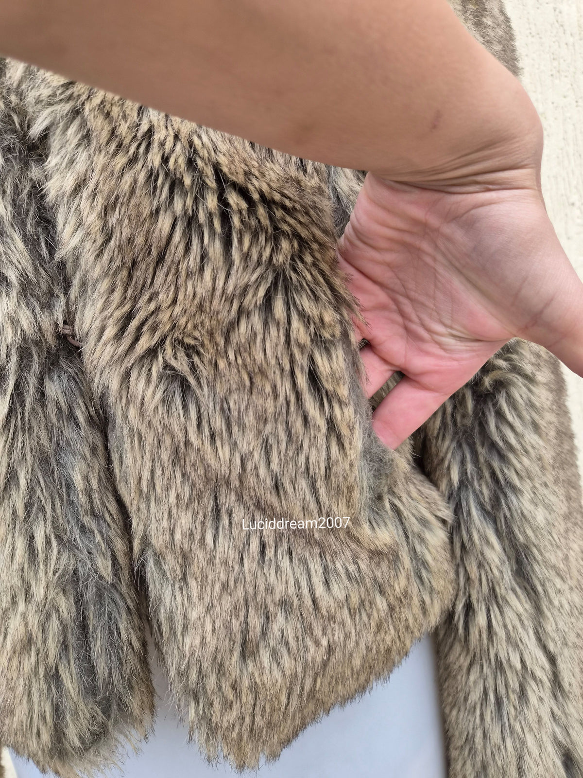 Manteau fausse fourrure beige