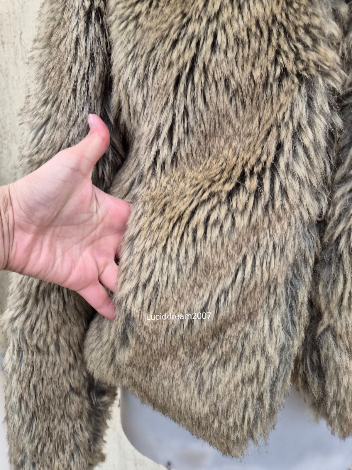 Manteau fausse fourrure beige