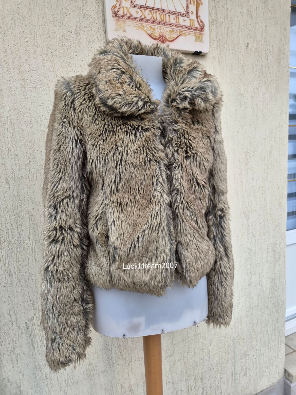 Manteau fausse fourrure beige