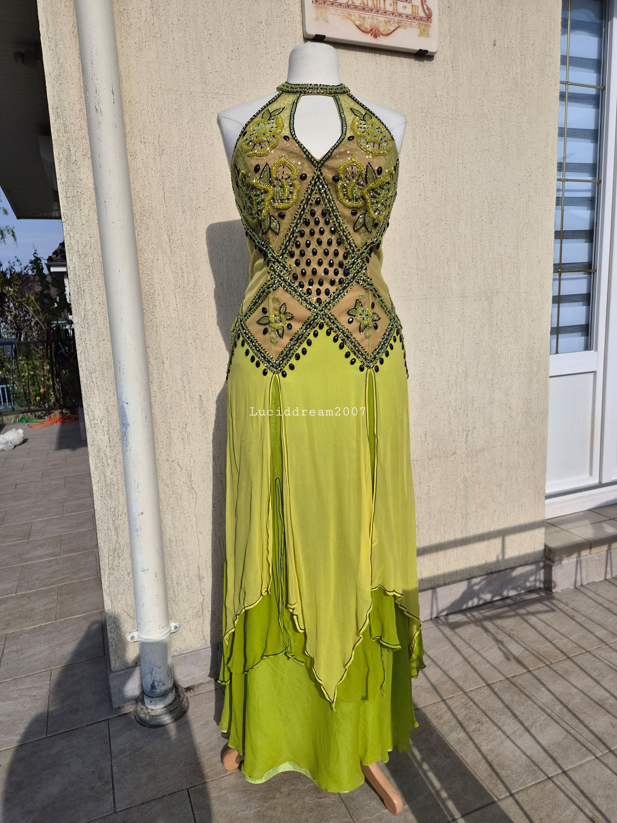 Embroidered silk dress in green tones