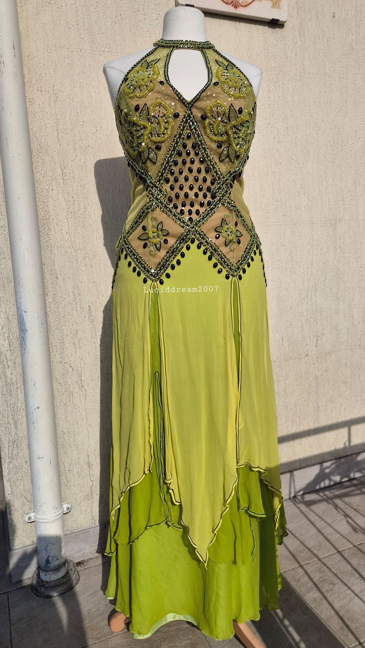 Embroidered silk dress in green tones