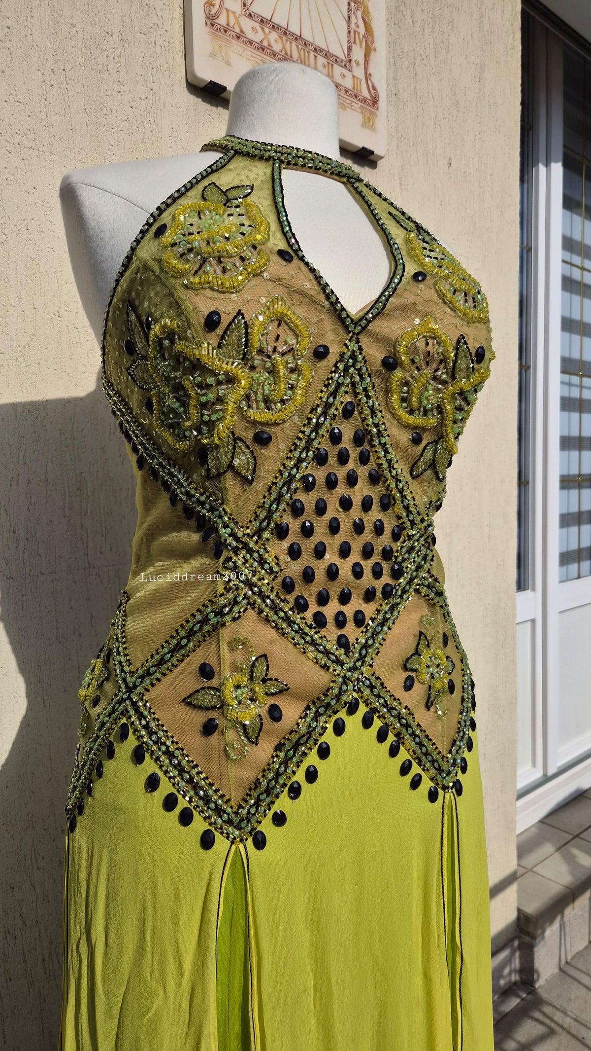 Embroidered silk dress in green tones
