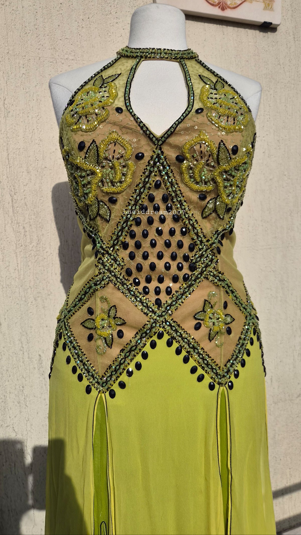 Embroidered silk dress in green tones