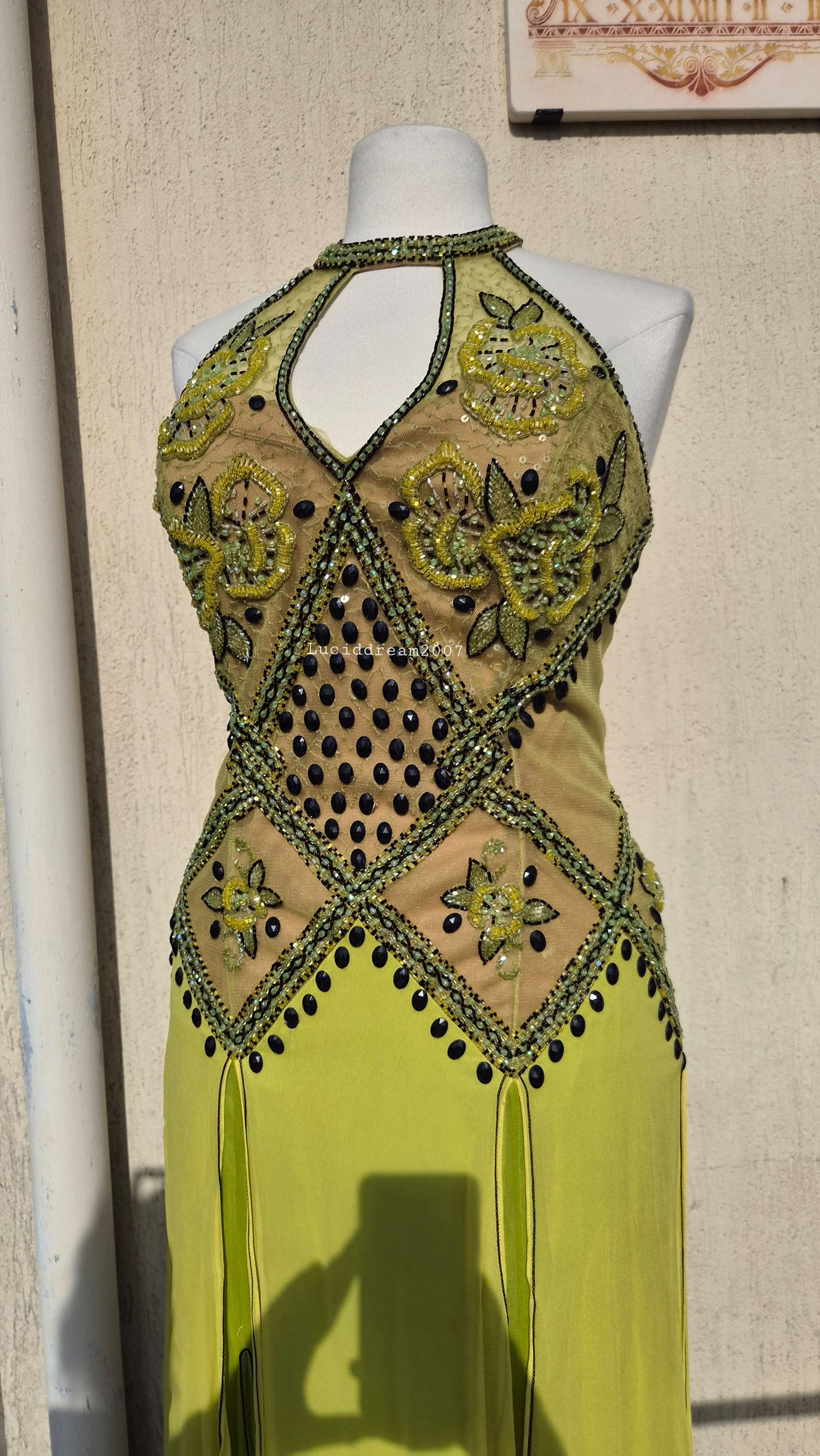 Embroidered silk dress in green tones