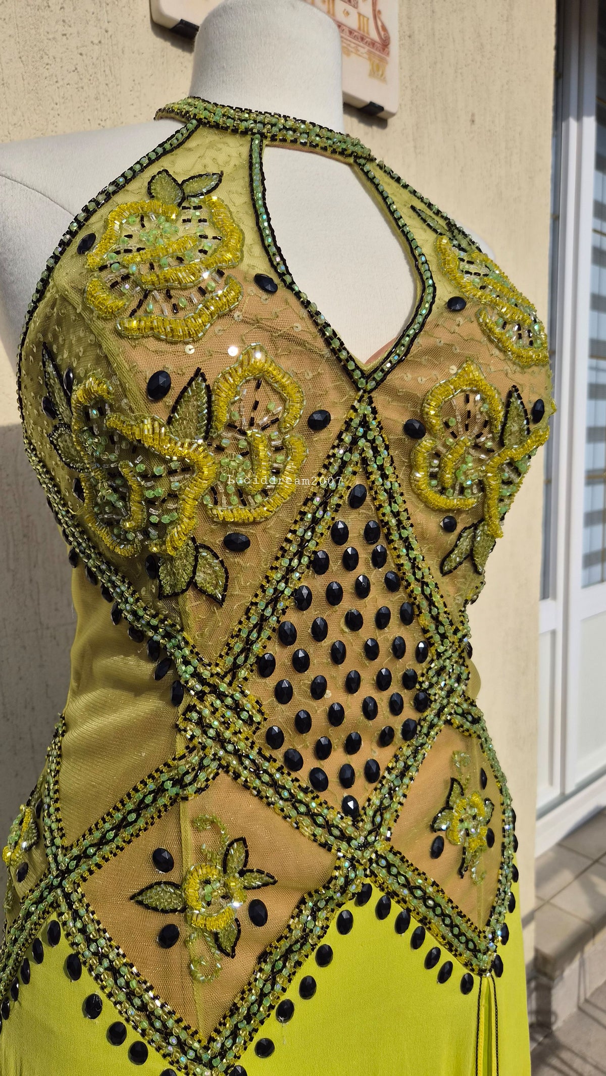 Embroidered silk dress in green tones