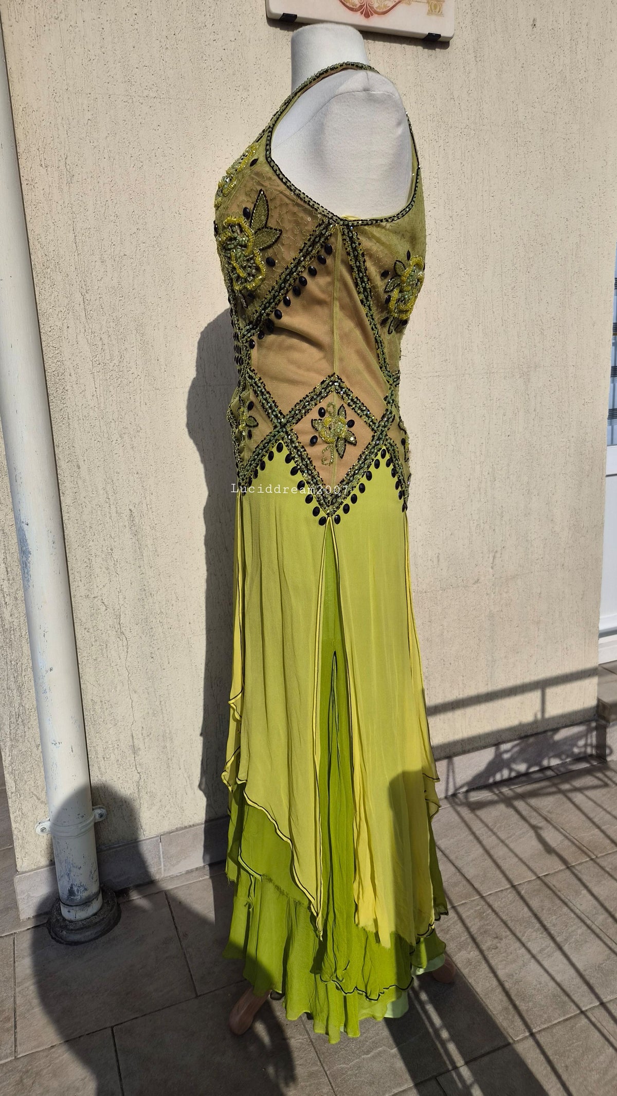 Embroidered silk dress in green tones