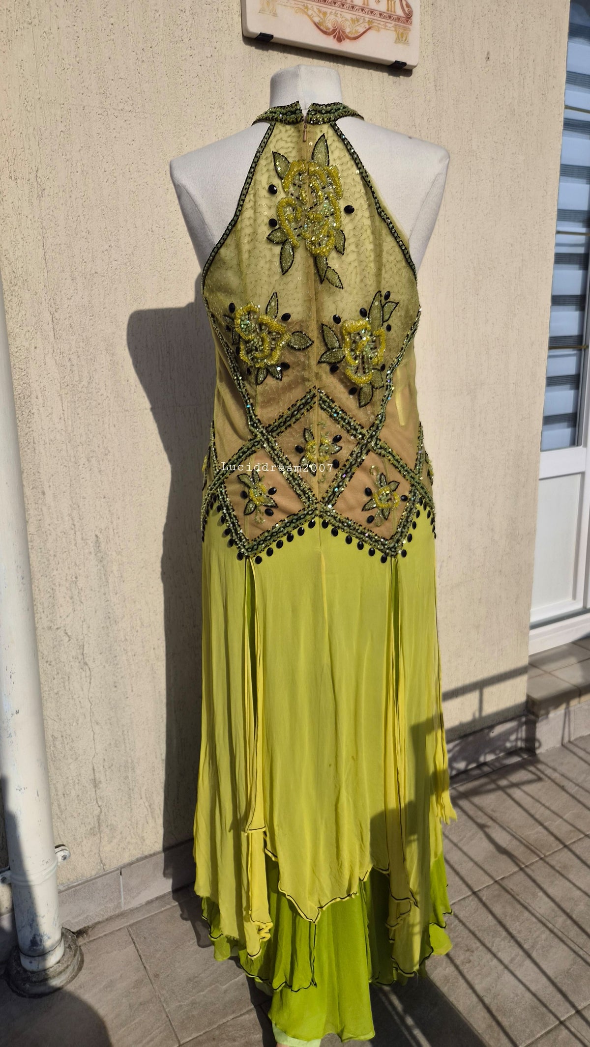 Embroidered silk dress in green tones