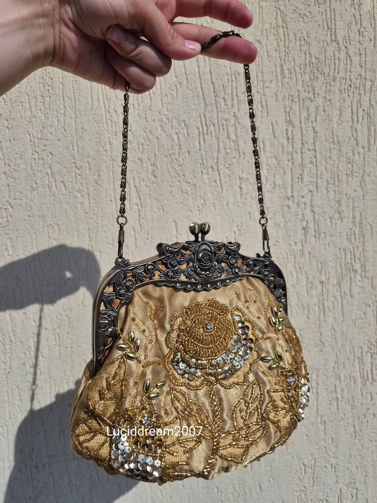 Embroidered gold bag
