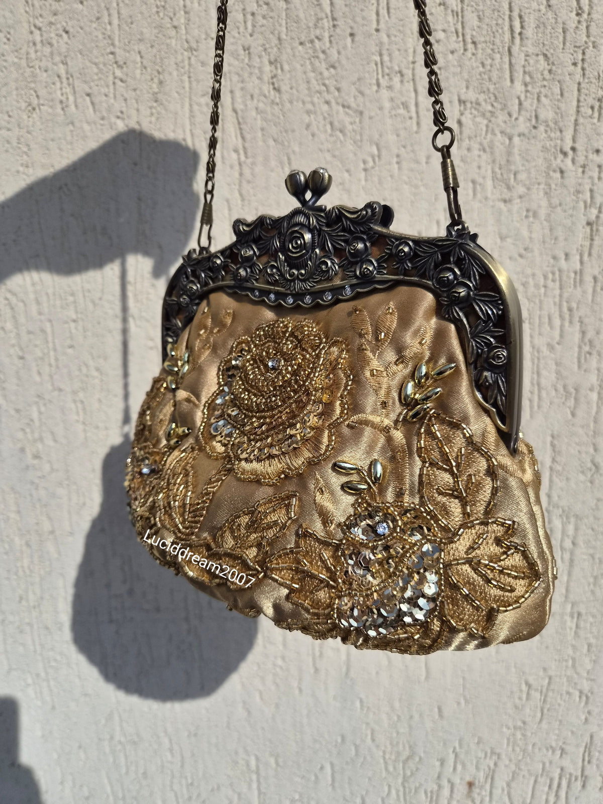 Embroidered gold bag