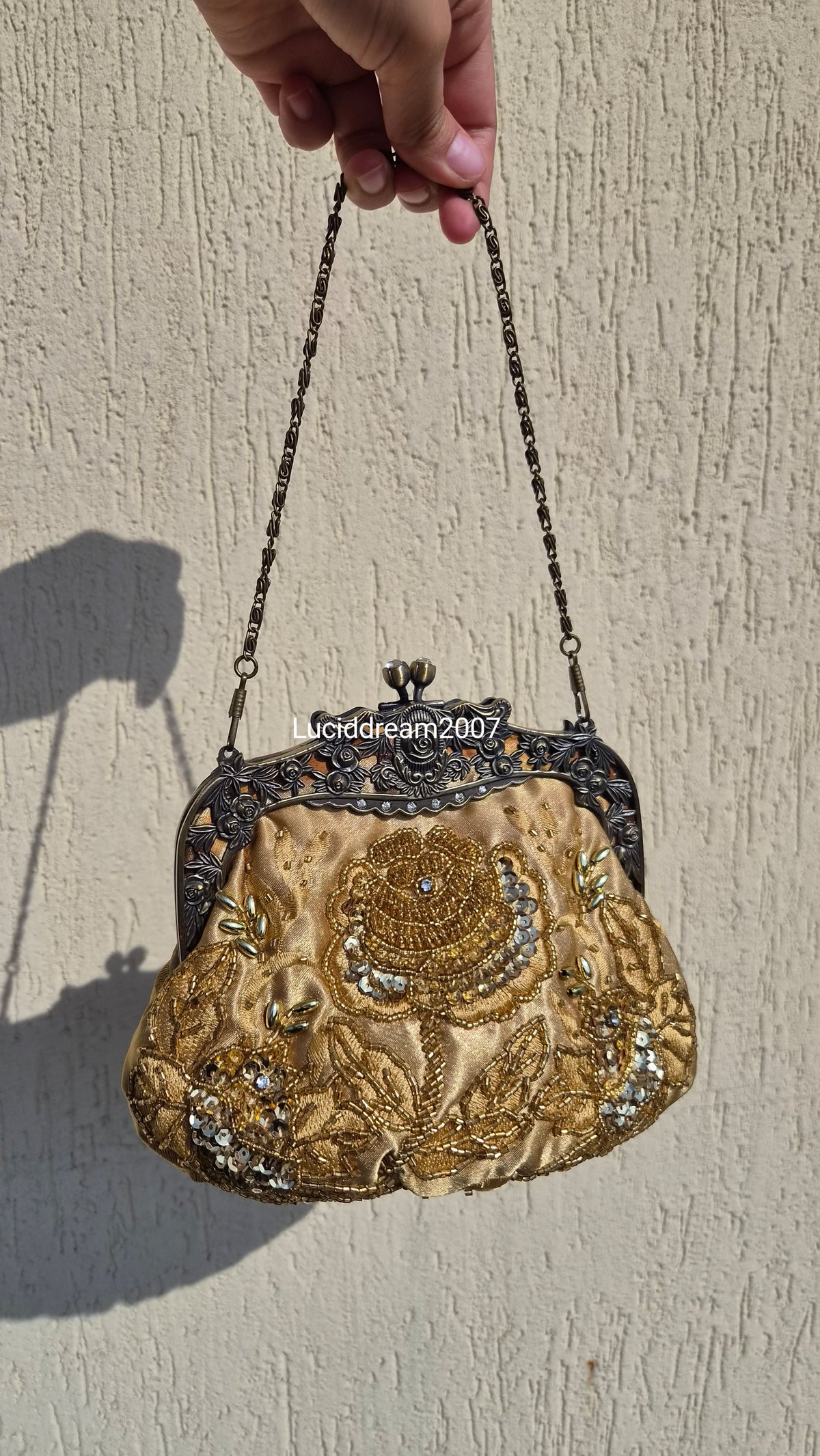 Embroidered gold bag