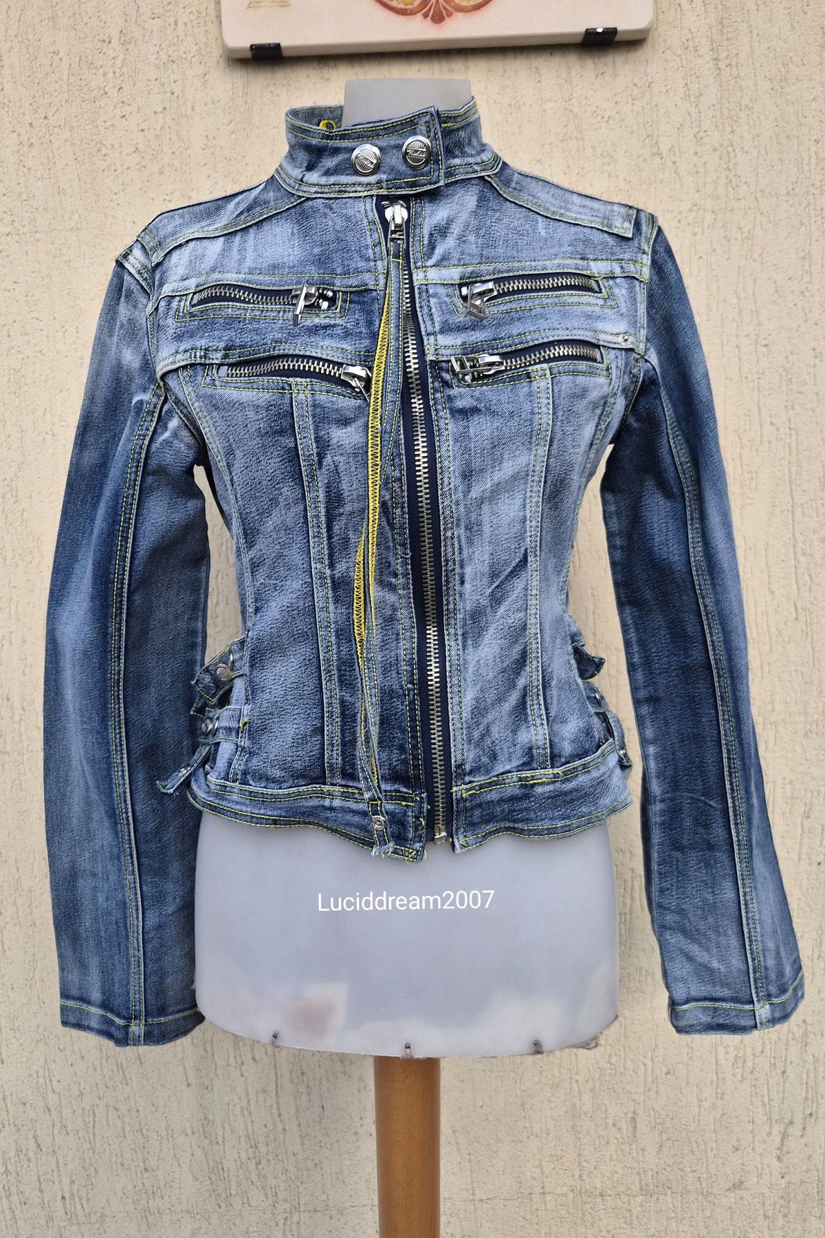 Denim jacket with zip and strap details