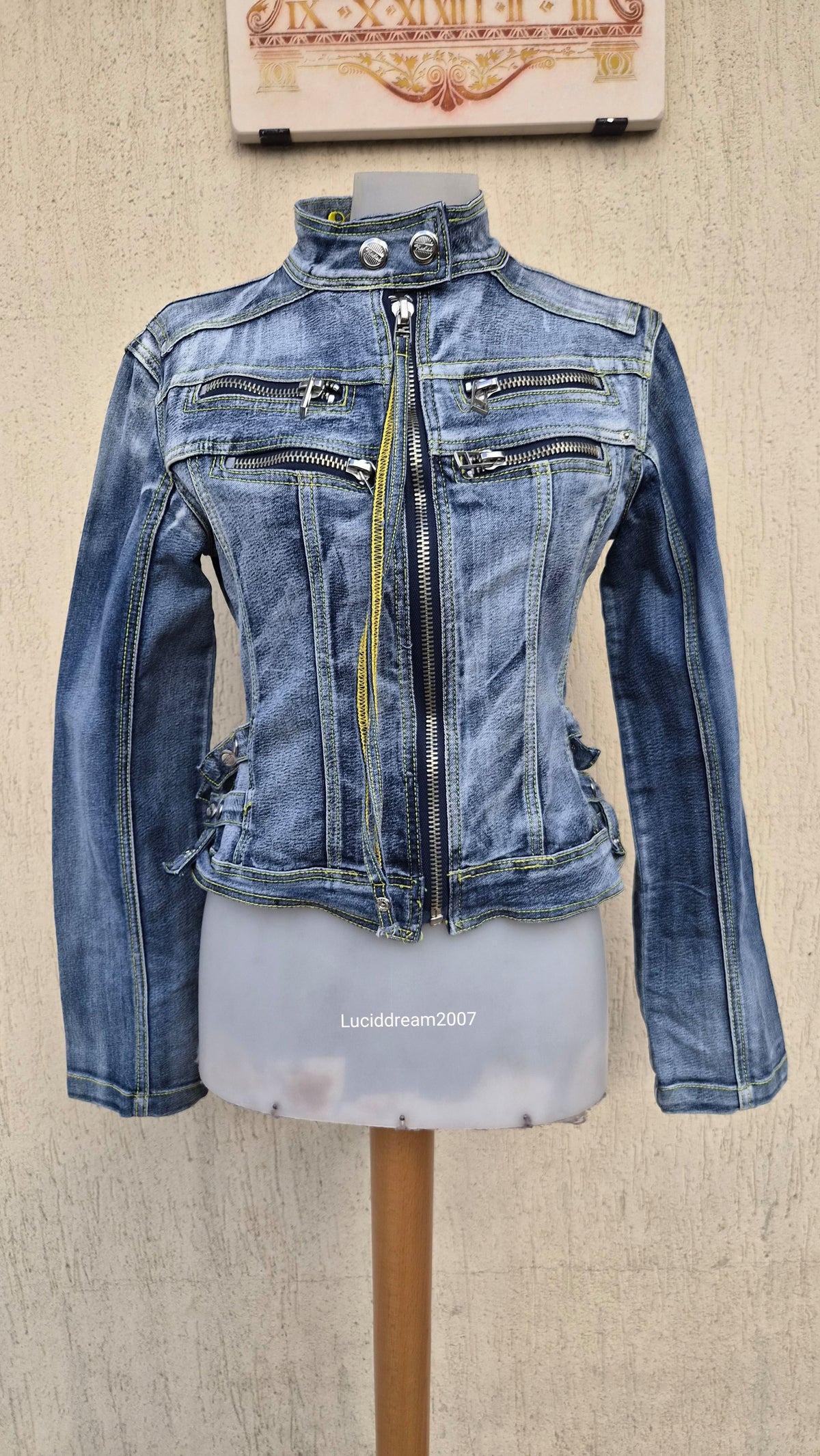 Denim jacket with zip and strap details